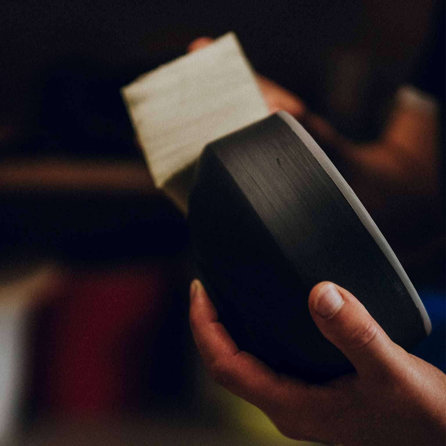 Polishing a matte black clay bowl