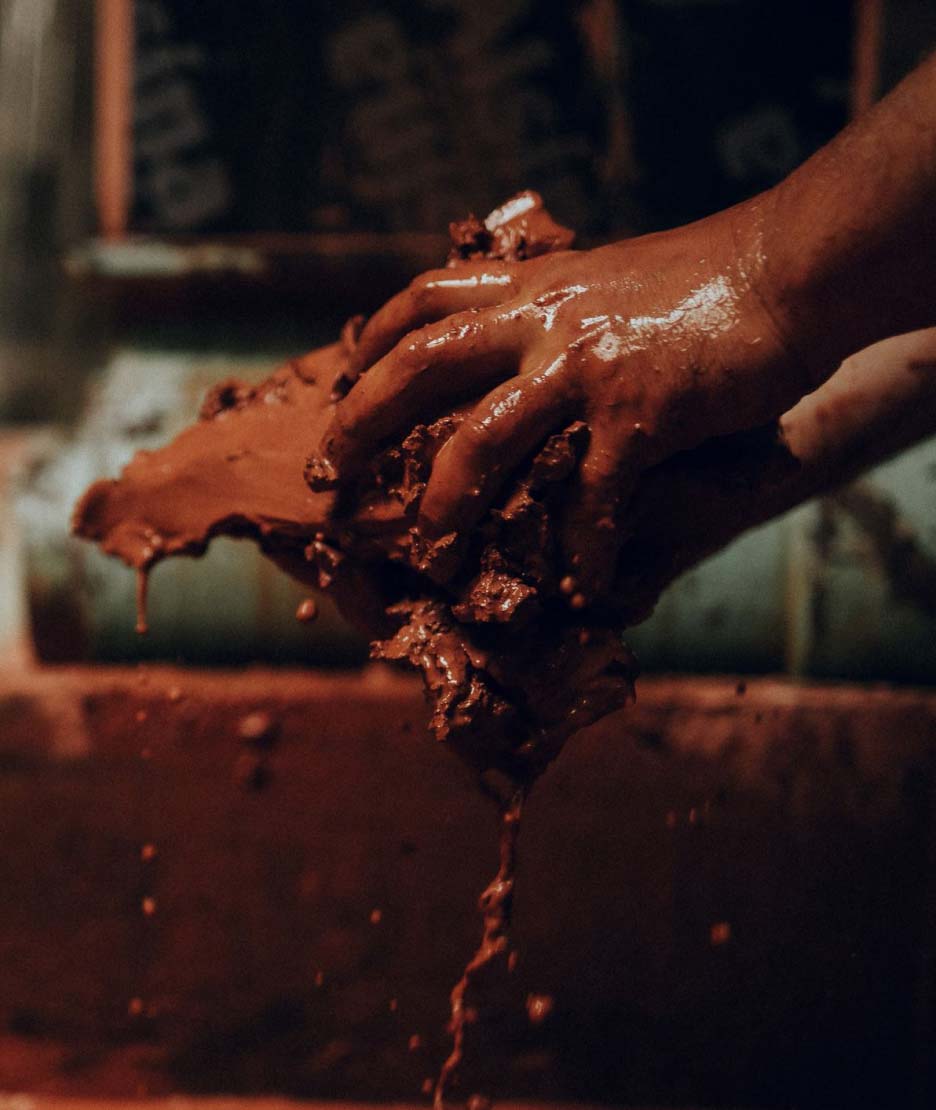 Washing the clay to remove all the impurities